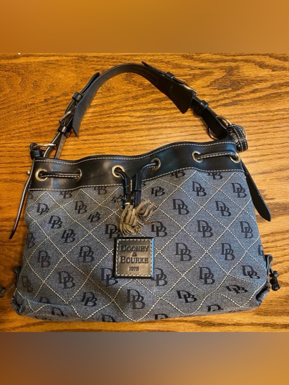 Dooney & Bourke Brown monogram canvas leather bucket drawstring shoulder bag